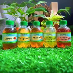 A selection of The Wellness Kraft Choose Your Mix Kombucha, allowing customers to customize their probiotic drink with various tea bases and flavor infusions.