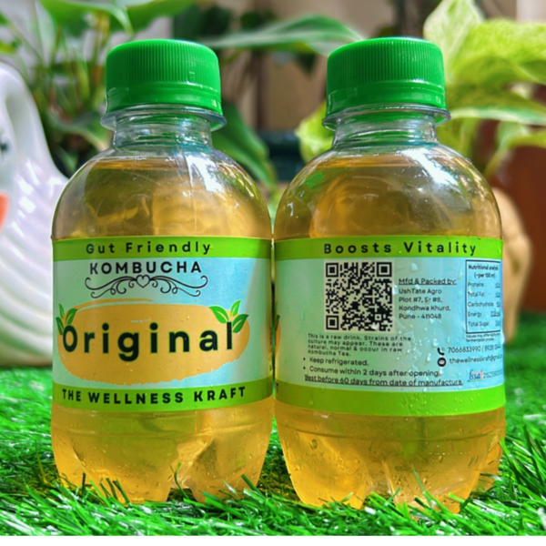 A bottle of The Wellness Kraft Kombucha, a naturally fermented probiotic drink that supports gut health and boosts immunity with a refreshing, healthy twist.